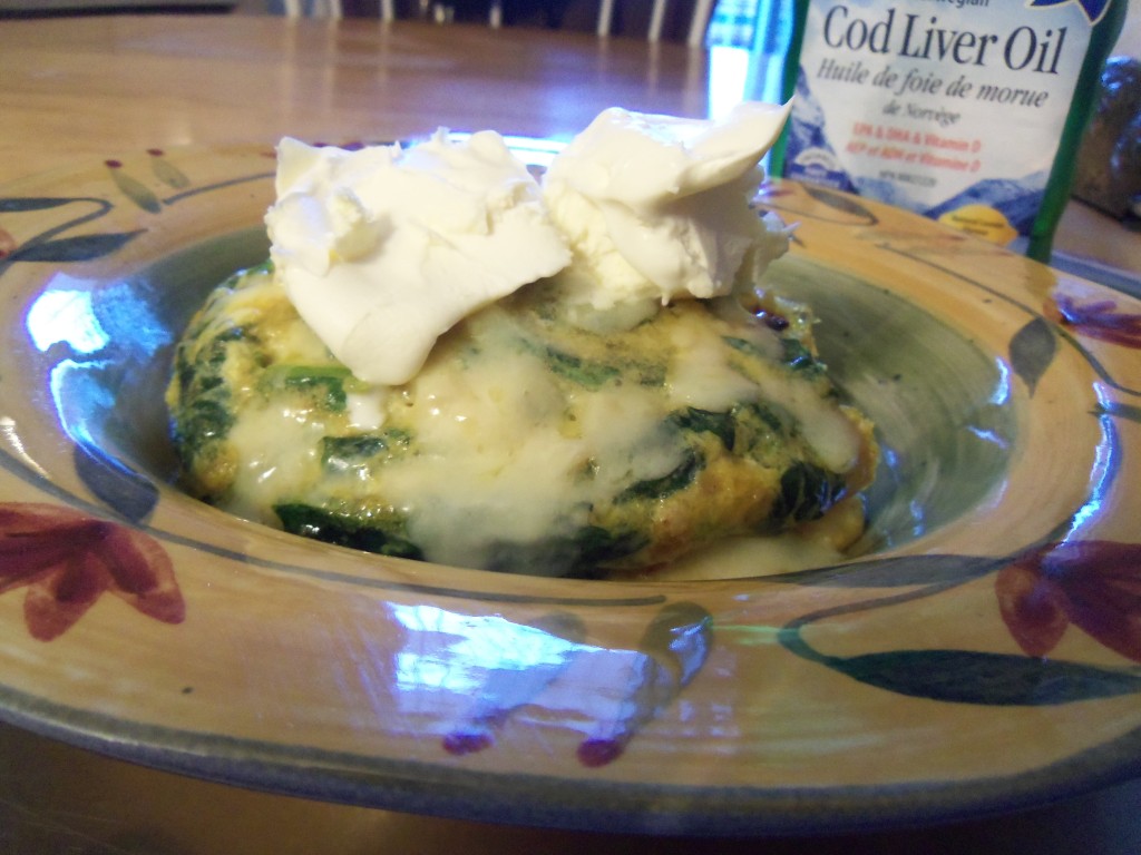 Nicole's favourite breakfrast. A fritatta made with 3 eggs, 1 cup of frozen spinach, 1TB of onion, curry and ghee. Covered with 1oz of raw grated cheddar cheese and more sour cream. 2-3g carb.
